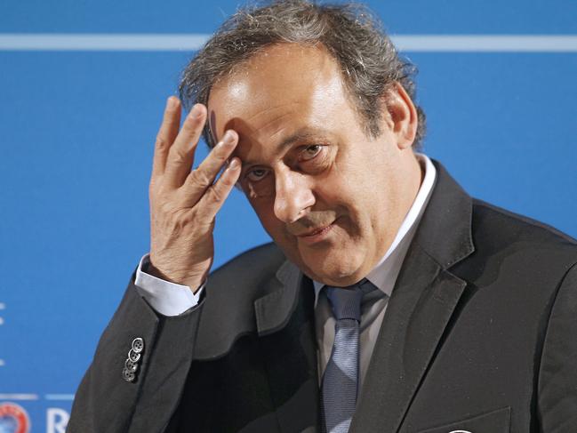 FILE - In this Feb.22, 2014 file photo, UEFA President Michel Platini arrives at a press conference, one day prior to the UEFA EURO 2016 qualifying draw in Nice, southeastern France. Former UEFA president Michel Platini has been arrested Tuesday June 18, 2019 over the awarding of the 2022 World Cup. (AP Photo/Lionel Cironneau, File)