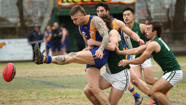 EFL: Lilydale’s Jayden Depace gets a kick under pressure. Picture: Hamish Blair