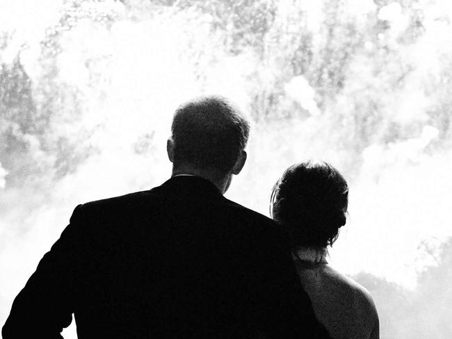 In a handout photograph released by Kensington Palace on December 14, 2018 shows Britain's Prince Harry, Duke of Sussex (L) and his wife Britain's Meghan, Duchess of Sussex (R) what fireworks at their wedding reception at Frogmore House in Windsor on May 19, 2018. - This photograph features on their Royal Highnesses’ Christmas card this year. (Photo by Chris ALLERTON / KENSINGTON PALACE / AFP) / RESTRICTED TO EDITORIAL USE - MANDATORY CREDIT "AFP PHOTO / KENSINGTON PALACE / CHRIS ALLERTON" - NO MARKETING NO ADVERTISING CAMPAIGNS - NO COMMERCIAL USE - NO THIRD PARTY SALES - RESTRCITED TO SUBSCRIPTION USE - NO CROPPING OR MODIFICATION - NOT FOR USE AFTER DECEMBER 31, 2019 - DISTRIBUTED AS A SERVICE TO CLIENTS /