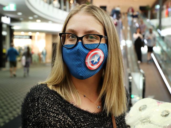 Kara Zigenbine wearing a face mask at Westfield Carindale, where several stores are on named on the government Covid list.Picture: Liam Kidston