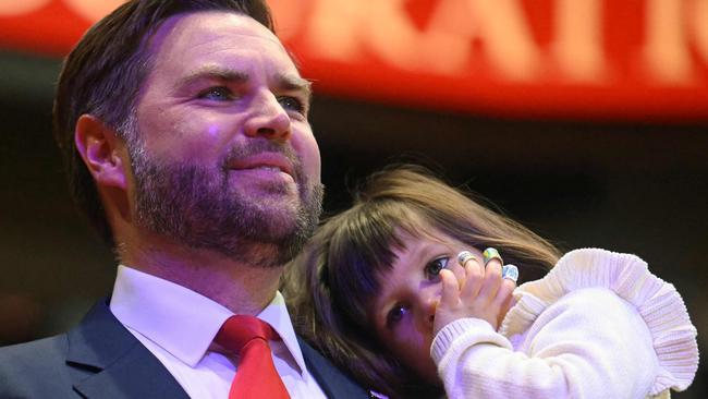 US Vice President J.D. Vance holds his daughter Mirabel as he arrives for the inaugural parade inside Capital One Arena, in Washington, DC, where she has Bluey, Scooby Do bandiads. Picture: AFP