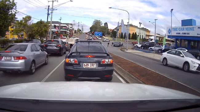 Screen grabs of eight teens running to a waiting car. Pic: Dash Cam Owners Australia Facebook