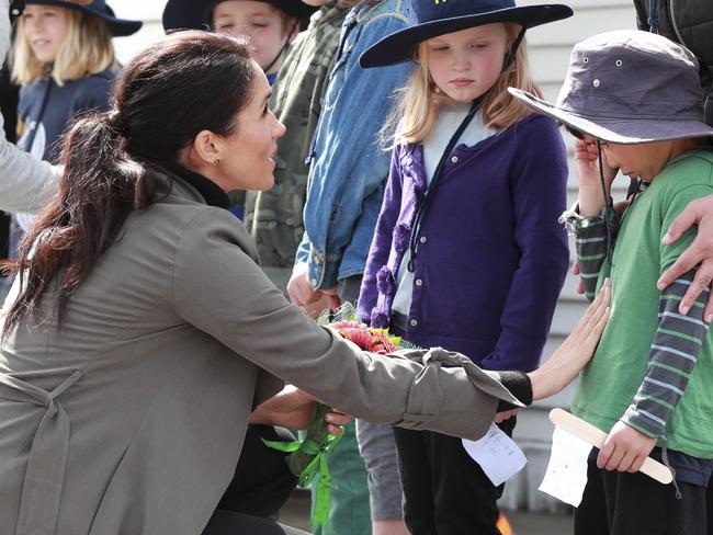 A caring Meghan comforts an overwhelmed Joe Young. Picture: AP