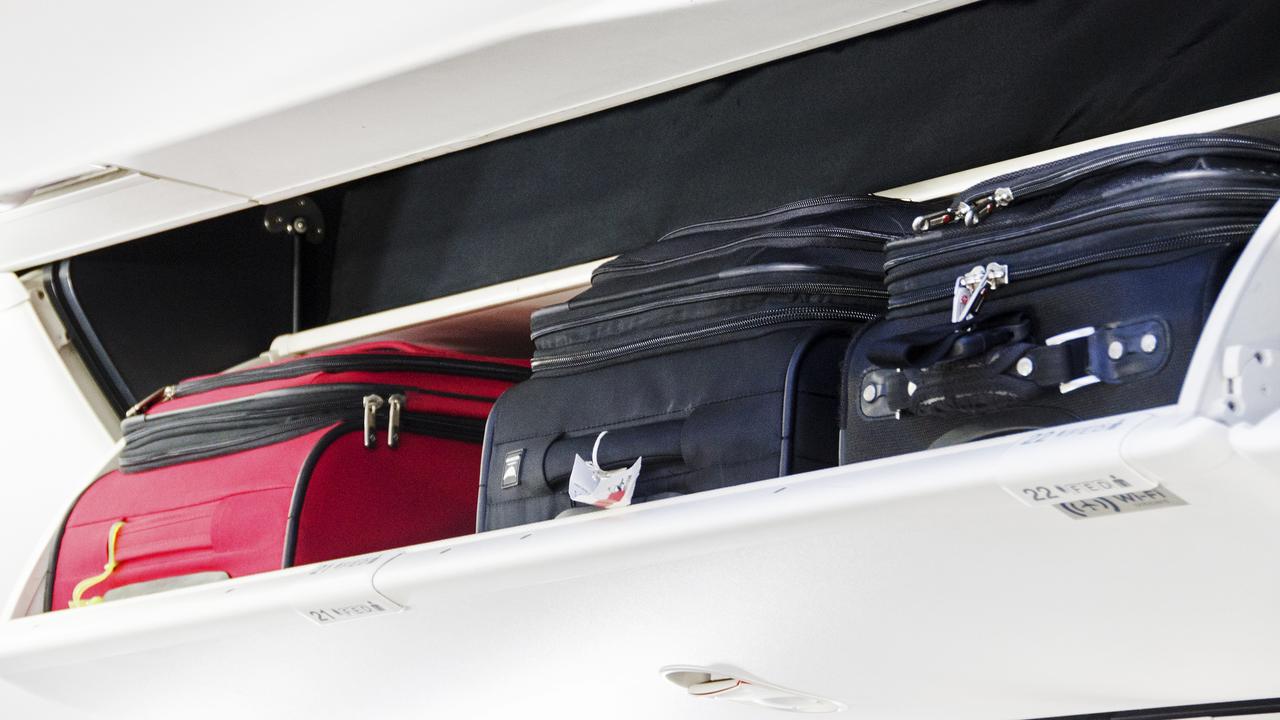 Some European airlines like Ryanair charge passengers to bring carry-on for the overhead lockers. Picture: iStock