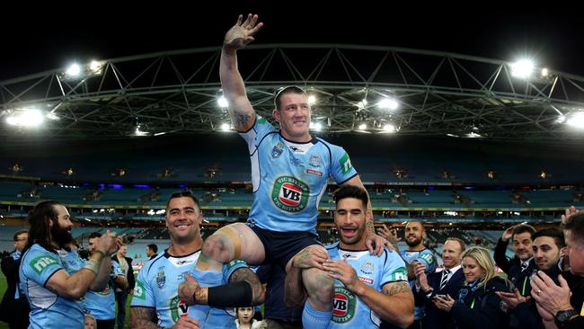 Paul Gallen is chaired off the ground by Andrew Fifita and James Tamou following his final game for the Blues.