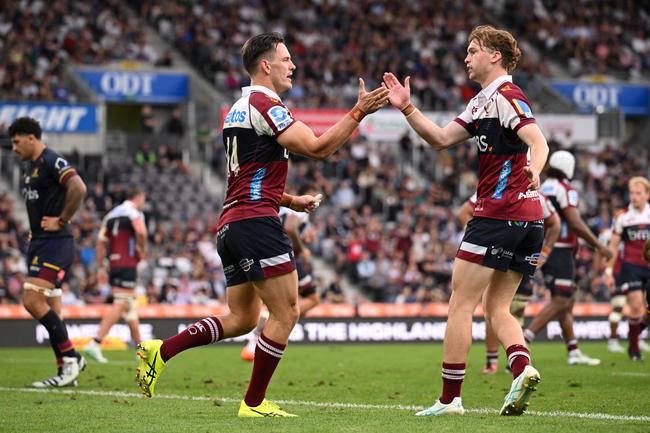 Lachie Anderson of the Reds celebrates after scoring a try. Photo by Joe Allison/Getty Images