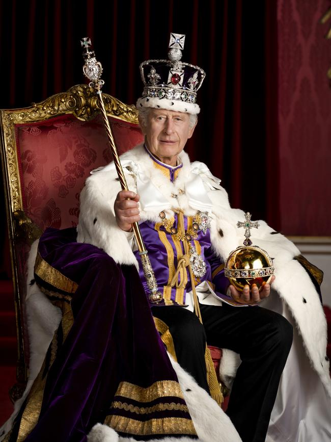 King Charles III is pictured in full regalia in the Throne Room at Buckingham Palace. The King is wearing the Robe of Estate, the Imperial State Crown and is holding the Sovereign's Orb and Sovereign's Sceptre with Cross. Photo by Hugo Burnand/Buckingham Palace via Getty Images