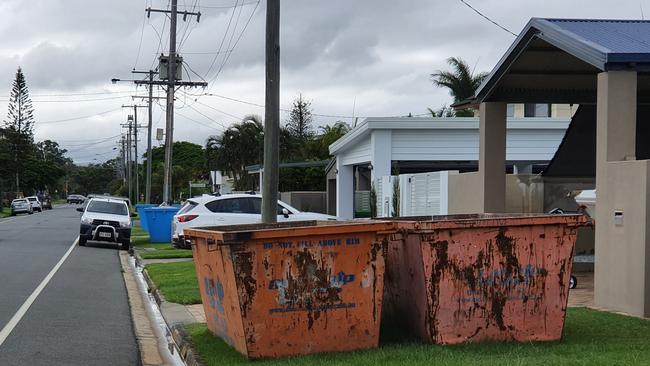 Skip bins out front of homes on Poinsettia Ave at Hollywell on Thursday. Picture: Luke Mortimer