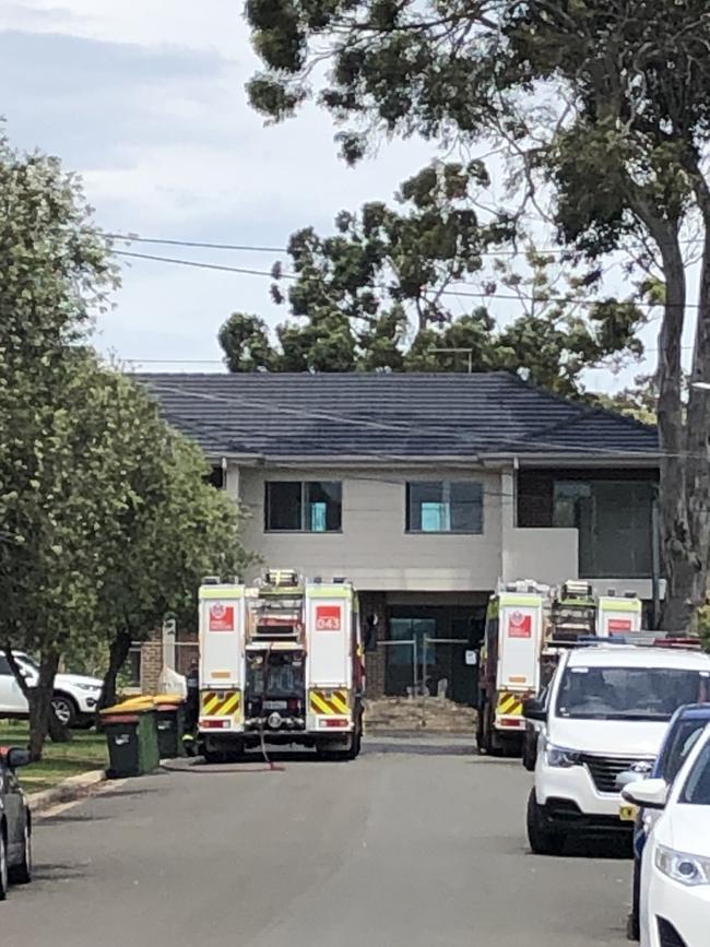 Two fire trucks outside the home where the man was killed.