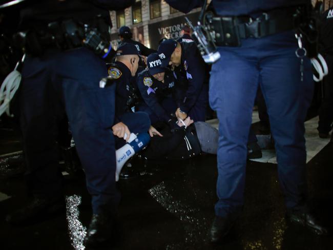 NYPD officers arrest a protestor during a protest against President-elect Donald Trump in New York City on November 9, 2016. Picture: AFP