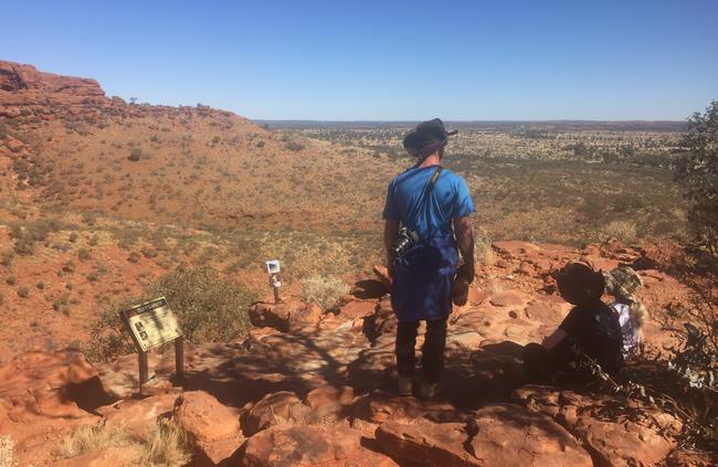 Adam, Mia and Skye soak in the outback landscape on the Kings Canyon Rim walk, Northern Territory.