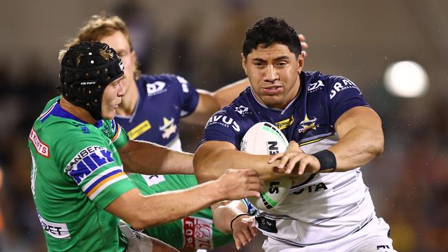 Jason Taumalolo bumps Raider Brad Schneider away. Picture: Mark Nolan/Getty Images