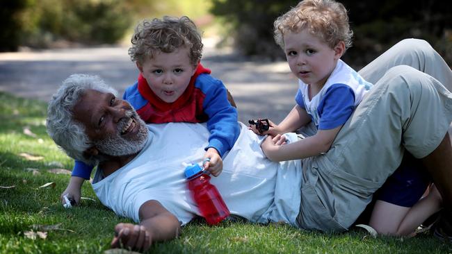 Ernie Dingo plays in Perth’s Kings Park with his twin sons Jimmy, left, and Stewie, 3. Picture: Colin Murty