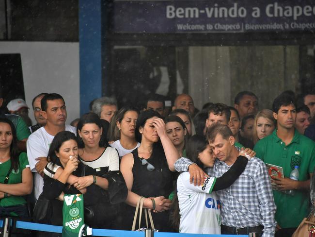 Relatives of the members of the team await their arrival at Chapeco airport in southern Brazil. Picture: AFP/Nelson Almeida