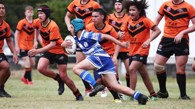 Brothers' Amari MacFarlane dashes around the Tigers' defence in the Cairns and District Junior Rugby League match between Cairns Brothers and Tully Tigers, held at Jones Park, Westcourt. PICTURE: BRENDAN RADKE