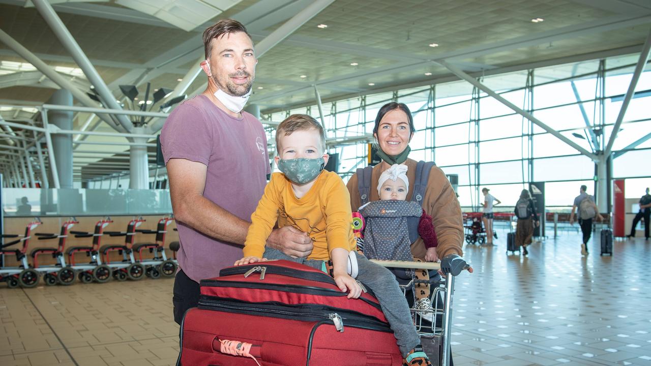 Peter and Allanah Watling with their seven-month-old baby Gigi and 3-year-old son Archie about to board the first flight to New Zealand as part of the travel bubble. Picture: Brad Fleet