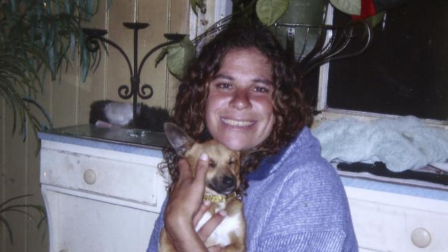 This 2010 photo released by the Daley family shows Lynette Daley cuddling her dog, Bunyip.