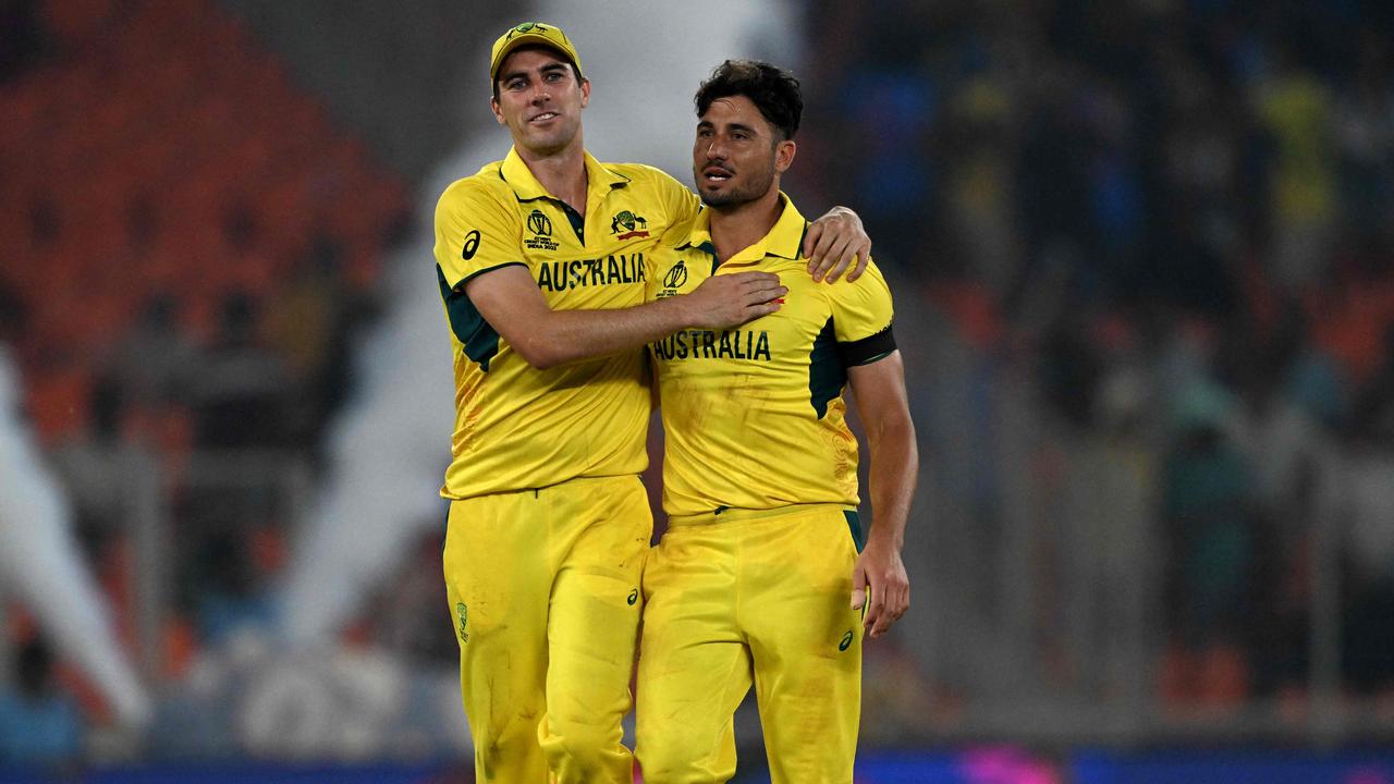 Pat Cummins and Marcus Stoinis celebrate a wicket against England. Picture: AFP Images