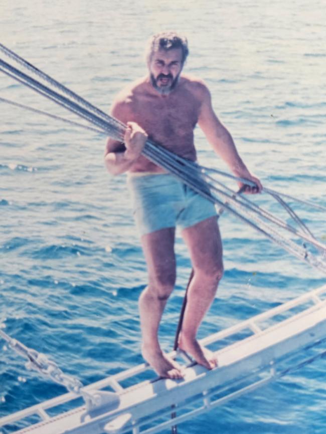 The building designer, who first lived on a trawler when he moved to Queensland. is pictured here on a boat in his younger days.