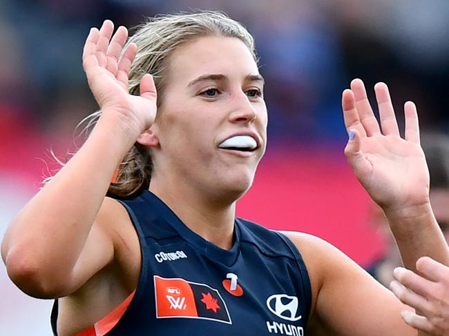 MELBOURNE, AUSTRALIA - SEPTEMBER 14: Abbie McKay of the Blues is congratulated by Celine Moody after kicking a goal during the round three AFLW match between Carlton Blues and Geelong Cats at Ikon Park, on September 14, 2024, in Melbourne, Australia. (Photo by Josh Chadwick/AFL Photos/via Getty Images)