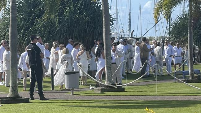 Security guards were posted throughout the Bundaberg Port Marina, guarding a roped-off area on the lawn for the wedding ceremony and reception.