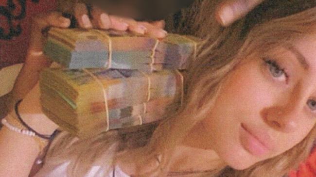 Isabella Fazzari handling cash prior to her arrest in January 2023. Picture: Supplied by Courts SA