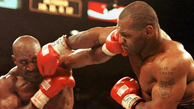 Tyson (right) famously took a chunk out of Evander Holyfield’s ear.