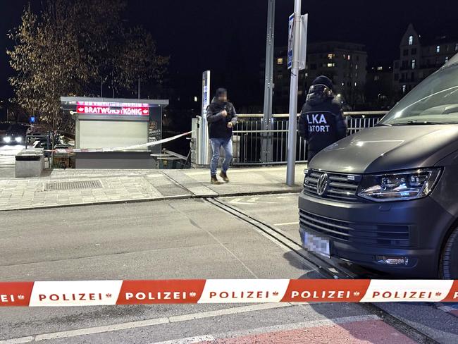 Officers of the Austrian State Criminal Police are seen near a police cordon after a knife attack near the main square in the city centre of Villach, southern Austria on February 15, 2025. A 14-year-old boy died and four other people were injured in the knife attack in southern Austria on February 15, police said, adding they have arrested a 23-year-old Syrian asylum seeker. (Photo by GERD EGGENBERGER / APA / AFP) / Austria OUT