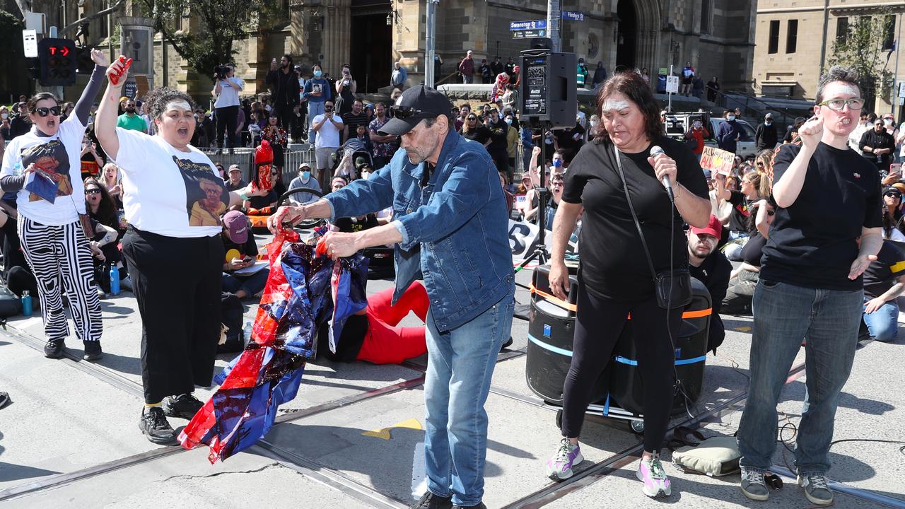 The flag was shredded and destroyed in front of the crowd. Picture: NCA NewsWire / David Crosling