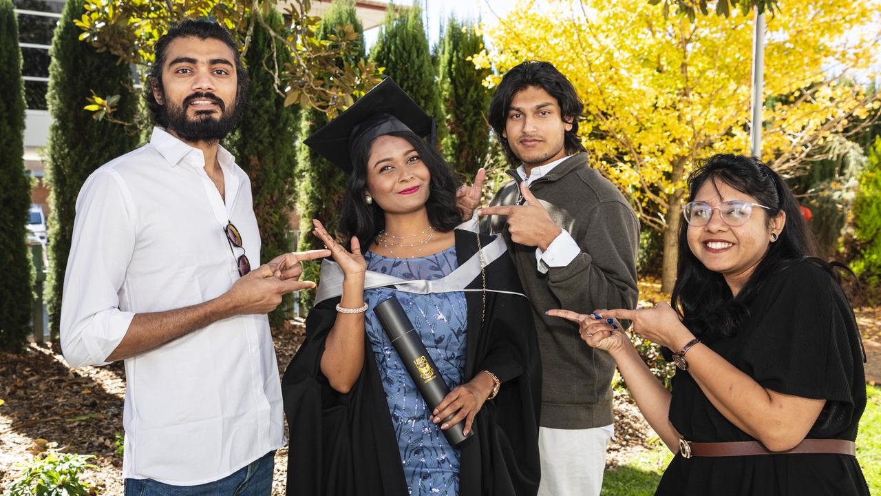 Master of Professional Accounting graduate Moumita Das celebrates her achievement with (from left) Karna Patel, Lahon Hossain and Krishna Ridham at a UniSQ graduation ceremony at Empire Theatres, Tuesday, June 27, 2023. Picture: Kevin Farmer