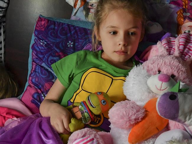 TOWNVILLE, SC - APRIL 29: Ava Olsen, 7, who was on the playground during the Townville Elementary shooting, poses for a picture with her stuffed animals on April 29, 2017 in Townville, S.C. Ava suffers from PTSD and no longer can attend school. She is home-schooled and probably will attend a different school next year.    On September 28, 2016, Jesse Osborne, 14, of Townville, South Carolina, allegedly took his father's handgun and shot his father several times in the back of the head killing him as he sat on the sofa. Soon after, Jesse took his father's truck and crashed it into a fence on the playground at nearby Townville Elementary School and opened fire on children playing on the playground and at other students  making their way to the playground. While Jesse was firing the handgun, he yelled repeatedly "I hate my life" to the students. After wounding three students and a teacher, his handgun jammed allowing a local firefighter to tackle him and pin him down until the police arrived. Two students and one teacher survived. One child, Jacob Hall, 6, died days later from injuries he sustained from a bullet in the leg. (Photo by Ricky Carioti/The Washington Post via Getty Images)