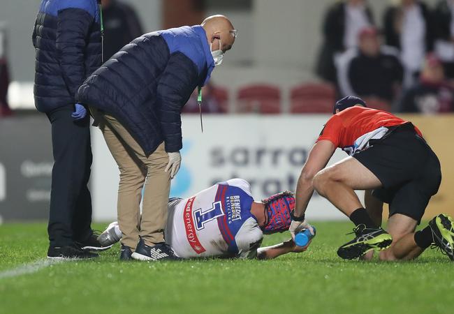 Newcastle's Kalyn Ponga down with concussion. Picture: Brett Costello