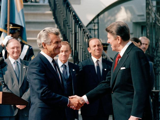 If only Trump was more like former US president Ronald Reagan, seen here welcoming former Australian prime minister Bob Hawke to the White House in Washington DC, in 1985, and championed the democratic ideal, laments Charles Wooley. Picture: National Archives of Australia