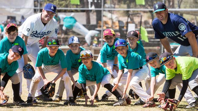 Australian baseball stars Trent Oeltjen (wearing Dodgers uniform) and Ryan Rowland-Smith at the baseball camp for juniors in Castle Hill. Pictures: Julian Andrews)