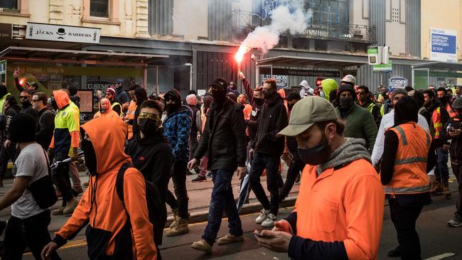 Construction workers march through Melbourne’s streets.