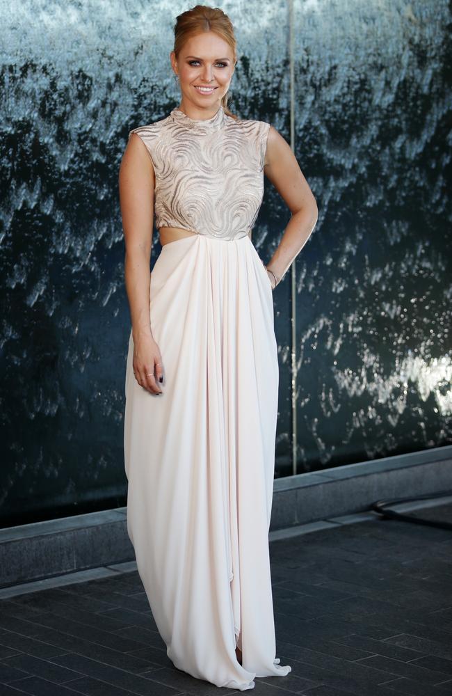 Julie Snook at the 2017 Allan Border Medal held at The Star in what she describes as a “rose gold” dress. Picture: Christian Gilles