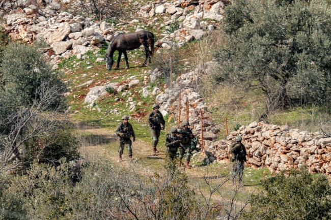 Israeli army forces patrol in the village of Kfarshuba in southern Lebanon on February 17, 2025