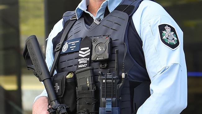 An AFP officer during the event  where PM Scott Morrison made a Counter terrorism announcement with Minister for Home Affairs Peter Dutton at Canberra Airport. Picture Kym Smith