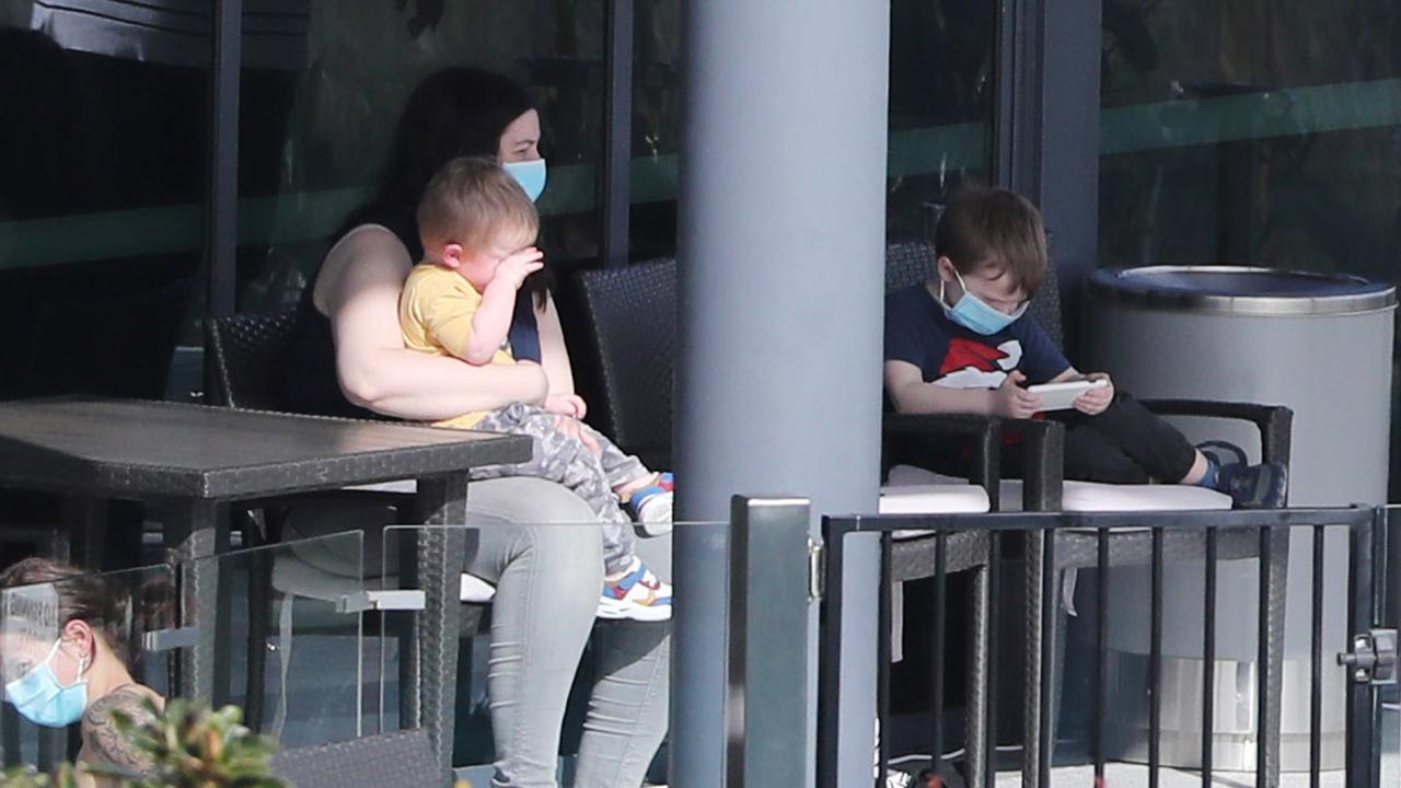 A family in isolation at the Brisbane Airport’s Pullman Hotel.