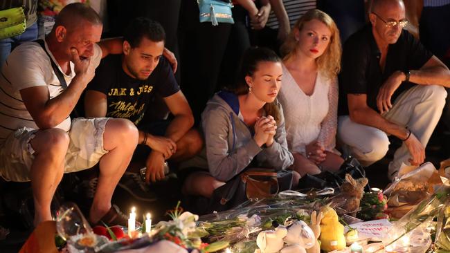 People at a makeshift memorial in Nice last night.