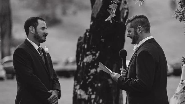 CHEERS: Adam and Rupert reading their vows at their country wedding on their property near Moore. Photo: Tessa Cox Photography.