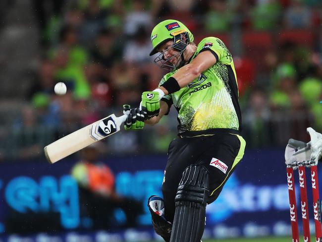 Thunder's Shane Watson smashes a six out of the ground off Heat's Mujeeb Ur Rahman during the BBL match between the Sydney Thunder and Brisbane Heat at Spotless Stadium. Picture. Phil Hillyard