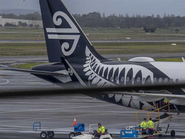 ADELAIDE, AUSTRALIA - NewsWire Photos JULY 16 2021: Adelaide Airport. Passengers are seen checking in with Air NewZealand plane. Picture: NCA NewsWire / Roy VanDerVegt