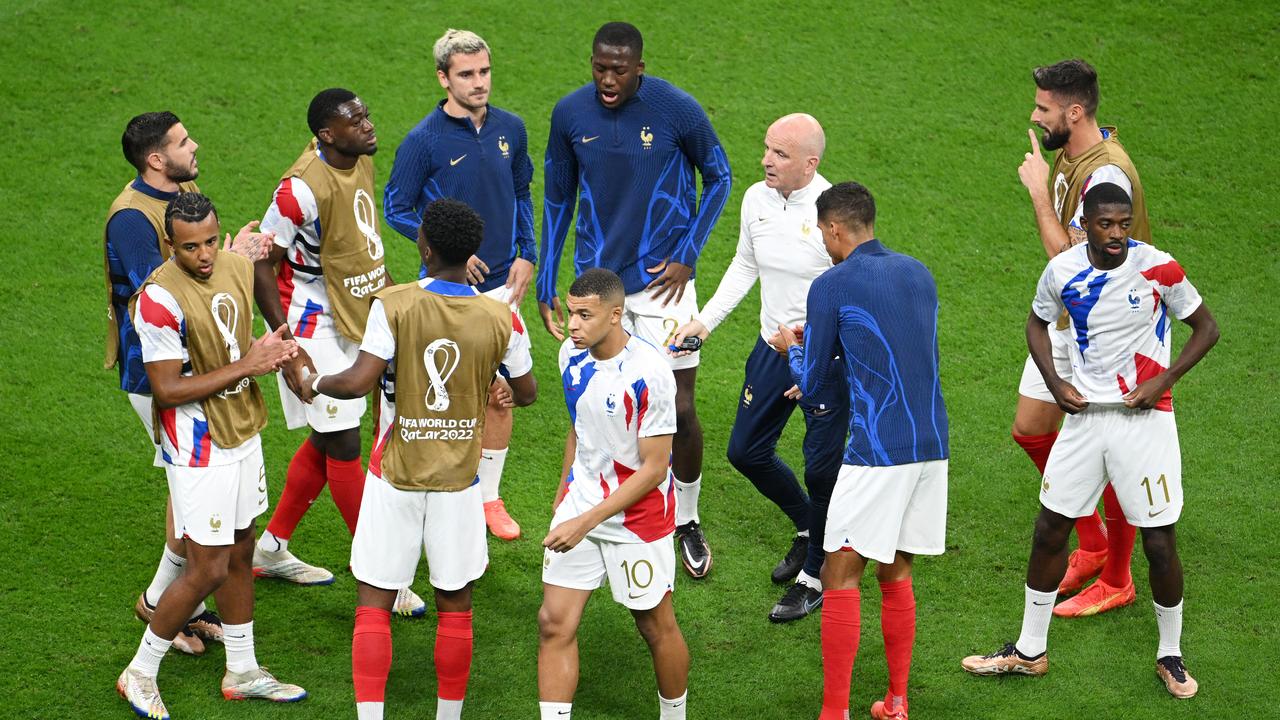 AL KHOR, QATAR - DECEMBER 14: France players enter a huddle in the warm up prior to the FIFA World Cup Qatar 2022 semi final match between France and Morocco at Al Bayt Stadium on December 14, 2022 in Al Khor, Qatar. (Photo by Matthias Hangst/Getty Images)