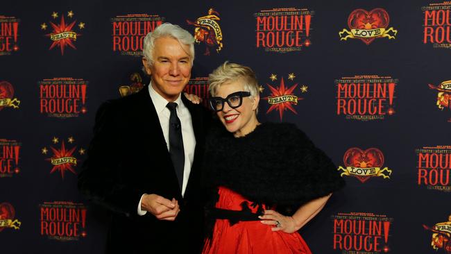 Baz Luhrmann and Catherine Martin walking the red carpet.