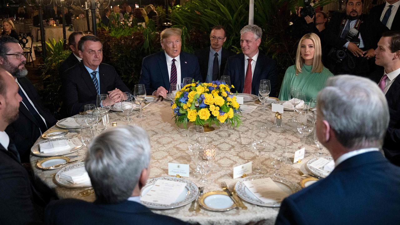 US President Donald Trump (centre) speaks with Brazilian President Jair Bolsonaro (left) during a diner at Mar-a-Lago in Palm Beach, Florida, on March 7, 2020. Picture: Jim Watson / AFP.