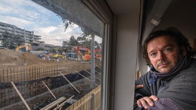 Tao Langham with a view of construction of the Kew Recreation Centre next to his New St home. Picture: Tony Gough