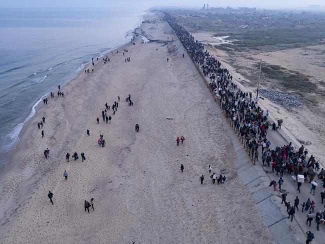 An aerial photograph taken by a drone shows displaced Palestinians return to their homes in the northern Gaza Strip, following Israel's decision to allow thousands of them to go back for the first time since the early weeks of the 15-month war with Hamas, Monday, Jan. 27, 2025. (AP Photo/ Mohammad Abu Samra)