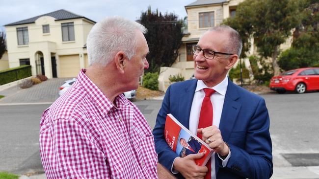 South Australian Premier Jay Weatherill is seen with Geoff Perkins (the owner of the house used for the media event) in Henley Beach today. Picture: AAP