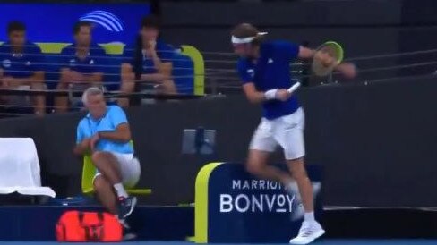 Stefanos Tsitsipas cracks his racquet and hits his dad in the process. Picture: Channel 9